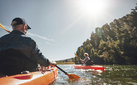 Couple kayaking on lake